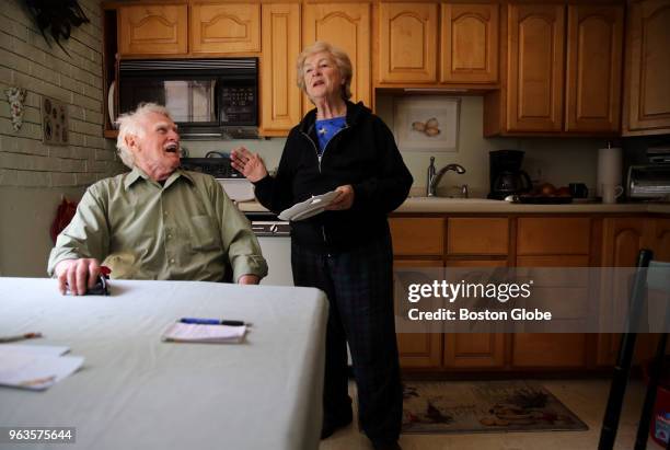 Stone mason Bill Doherty shares a laugh with Ann Marie Sullivan, his partner of 20-years, at their home in Westwood, MA on May 18, 2018. While many...