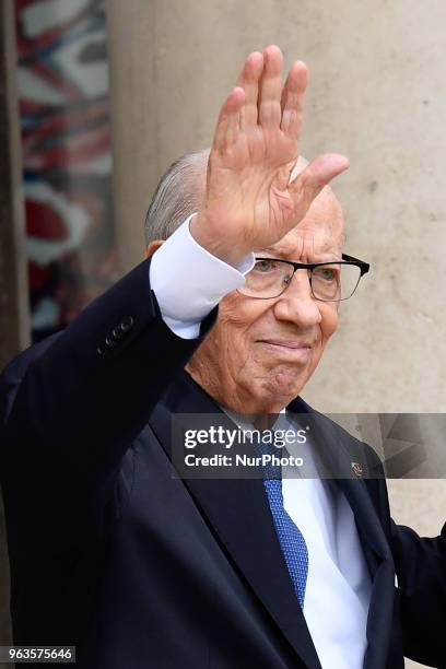 Tunisia's President Beji Caid Essebsi waves as he arrives for an international conference on Libya at the Elysee Presidential Palace on May 29 in...