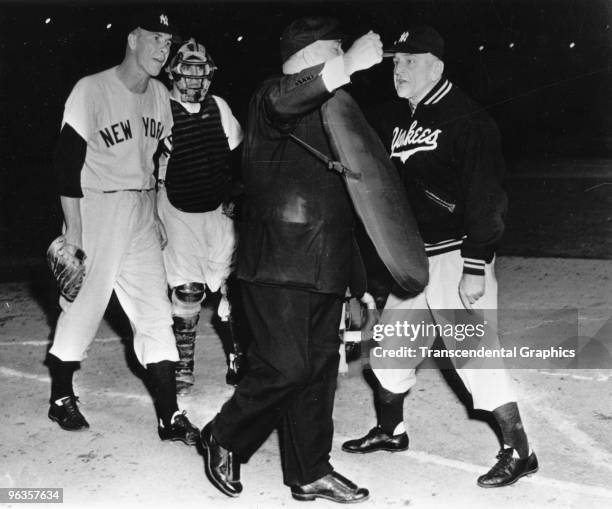 Manager Casey Stengel of the New York Yankees argues with umpire Bill Summers during a 1954 game against the Cleveland Indians in Cleveland, Ohio....