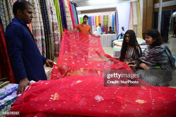 Peoples visit the Jamdani Sari exhibition at National Museum in Dhaka, Bangladesh, May 29, 2018.The Jamdani Sari exhibition was organized by...