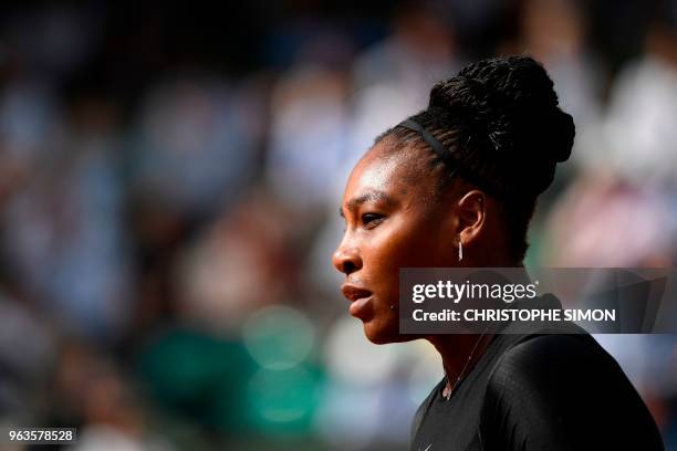 Serena Williams of the US walks on court after a point against Czech Republic's Kristyna Pliskova during their women's singles first round match on...