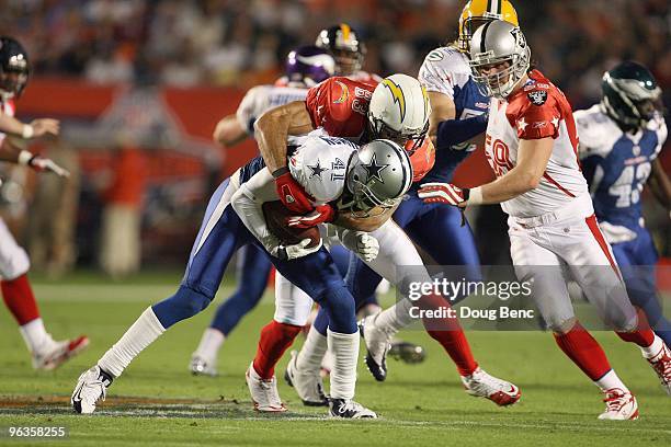 Terence Newman of the Dallas Cowboys makes a interception attended for Vincent Jackson of the San Diego Chargers during the 2010 AFC-NFC Pro Bowl at...