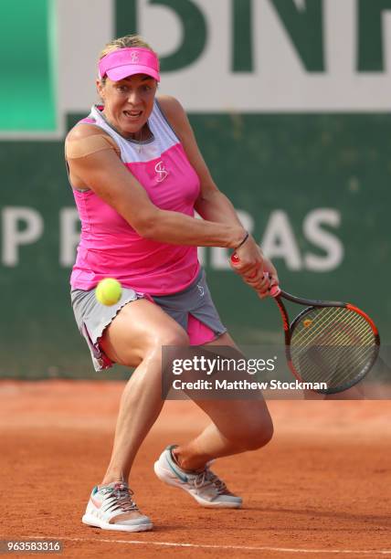 Anastasia Pavlyuchenkova of Russia plays a backhand during the ladies singles first round match against Polona Hercog of Slovenia during day three of...