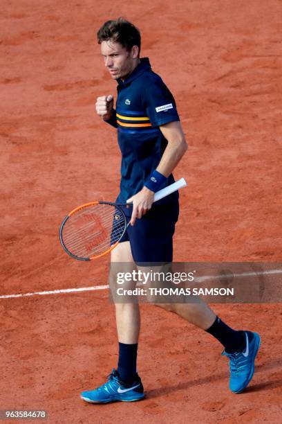 France's Nicolas Mahut reacts after a point against Argentina's Juan Martin del Potro during their men's singles first round match on day three of...