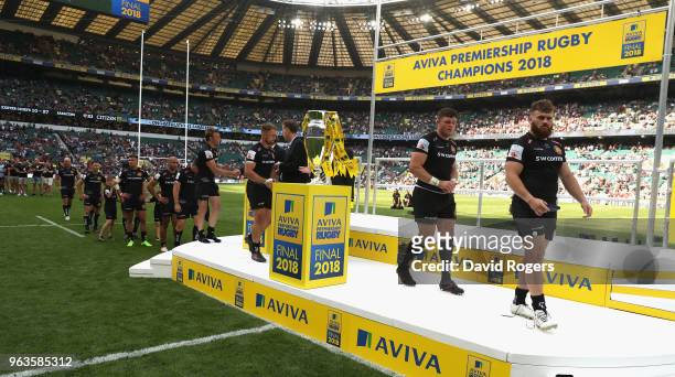 The defeated Exeter Chiefs side collect their medals during the Aviva Premiership Final between Exeter Chiefs and Saracens at Twickenham Stadium on...