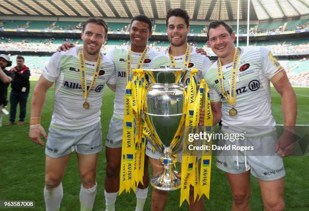 Chris Wyles, Nathan Earle, Sean Maitland and Alex Goode of Saracens celebrate their win during the Aviva Premiership Final between Exeter Chiefs and...