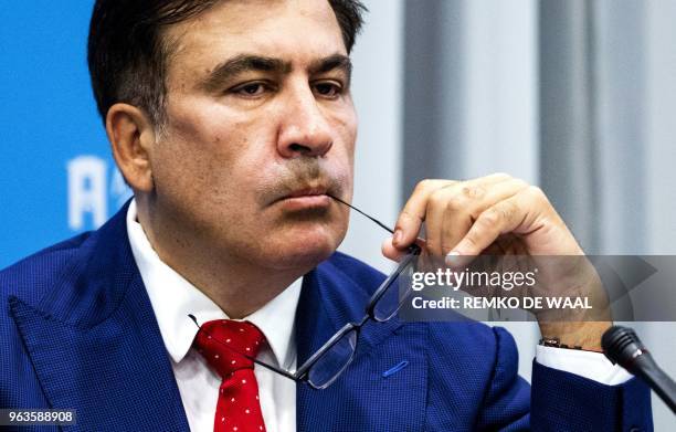 Former Georgian president and Ukrainian opposition leader Mikheil Saakashvili looks on during a press conference about his expulsion from Ukraine on...