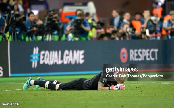 Liverpool goalkeeper Loris Karius lying dejected on the pitch after the UEFA Champions League Final between Real Madrid and Liverpool at NSC...