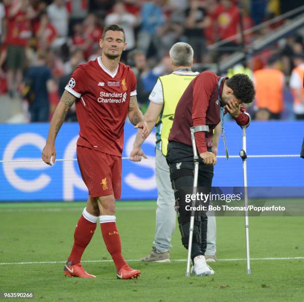 Dejected Liverpool players Dejan Lovren and the injured Alex Oxlade-Chamberlain after the UEFA Champions League Final between Real Madrid and...