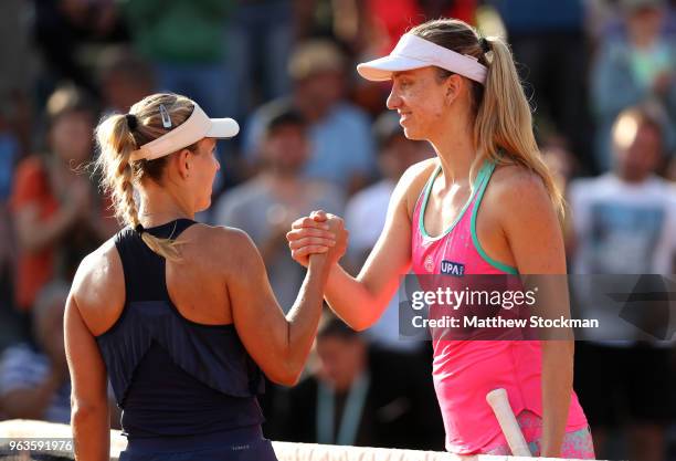 Mona Barthel of Germany congratulates Angelique Kerber of Germany on victory following their ladies singles first round match during day three of the...