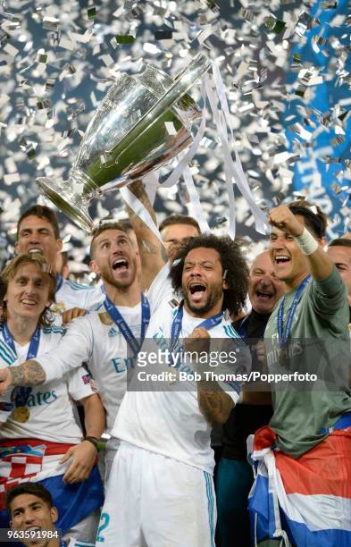 Marcelo of Real Madrid celebrates with the trophy after the UEFA Champions League Final between Real Madrid and Liverpool at NSC Olimpiyskiy Stadium...