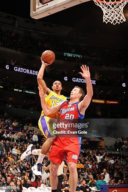 Shannon Brown of the Los Angeles Lakers takes the ball to the basket against Steve Novak of the Los Angeles Clippers during the game at Staples...