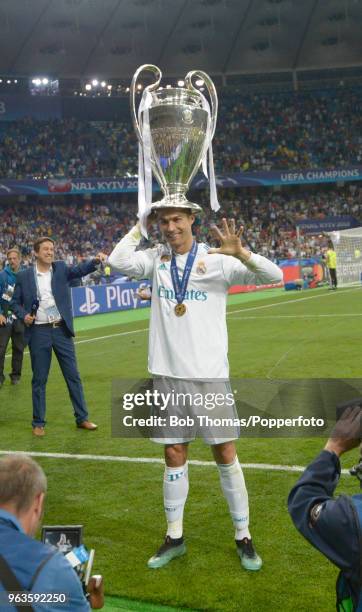 Cristiano Ronaldo of Real Madrid celebrates with the trophy after the UEFA Champions League Final between Real Madrid and Liverpool at NSC...