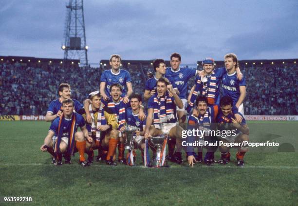 Rangers players celebrate with the trophy after the Skol Cup Final between Rangers and Celtic at Hampden Park on October 26, 1986 in Glasgow,...
