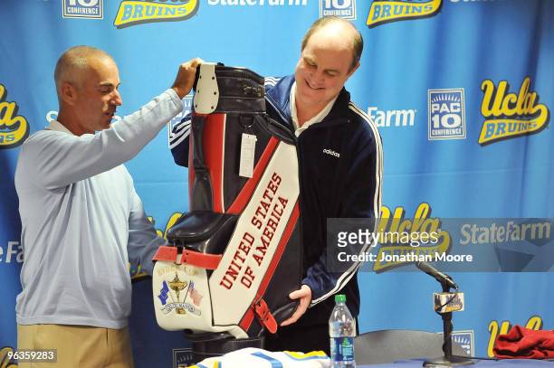 Ryder Cup Captain Corey Pavin presents UCLA Head Basketball Coach Ben Howland with an autographed golf club bag at UCLA on February 2, 2010 in Los...