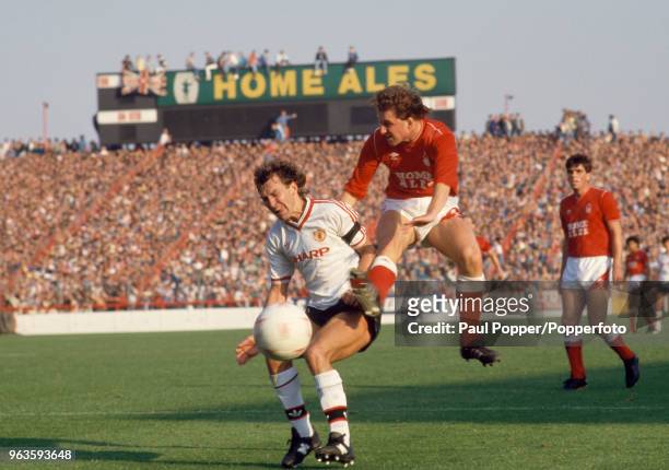 David Campbell of Nottingham Forest clashes with Bryan Robson of Manchester United during a Today League Division One match at the City Ground on...
