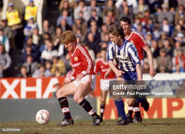 Gordon Strachan of Manchester United is closed down by Glynn Snodin of Sheffield Wednesday during a Today League Division Hillsborough on March 21,...
