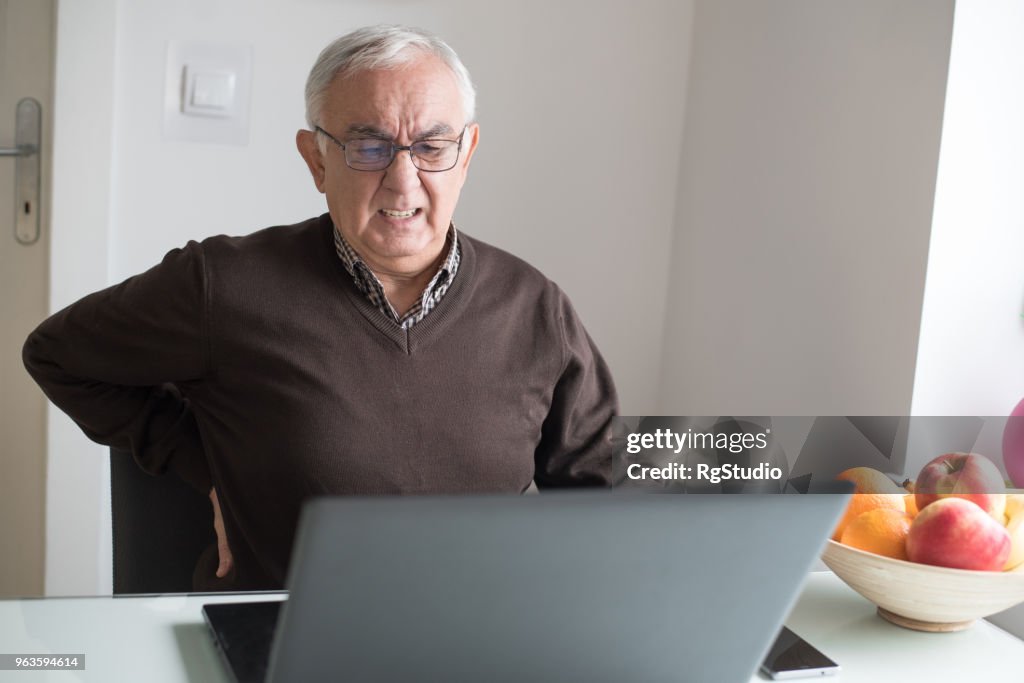Senior man with back pain