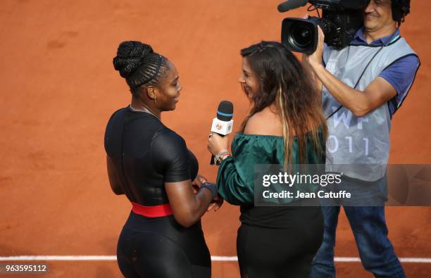 Serena Williams of USA is interviewed by Marion Bartoli following her victory during Day Three of the 2018 French Open at Roland Garros on May 29,...