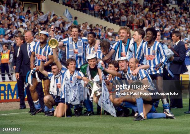 Coventry City celebrate with the trophy after the FA Cup Final between Coventry City and Tottenham Hotspur at Wembley Stadium on May 16, 1987 in...