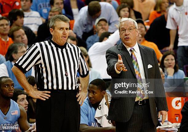 Head coach Roy Williams of the North Carolina Tar Heels and an official against the Clemson Tigers at Littlejohn Coliseum on January 13, 2010 in...