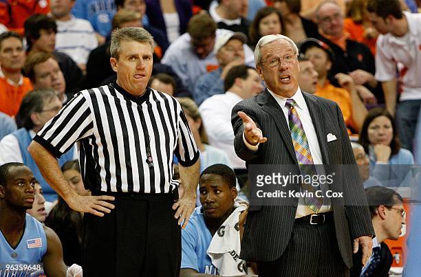 Head coach Roy Williams of the North Carolina Tar Heels and an official against the Clemson Tigers at Littlejohn Coliseum on January 13, 2010 in...