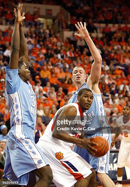 Ed Davis and Travis Wear of the North Carolina Tar Heels against Trevor Booker of the Clemson Tigers at Littlejohn Coliseum on January 13, 2010 in...