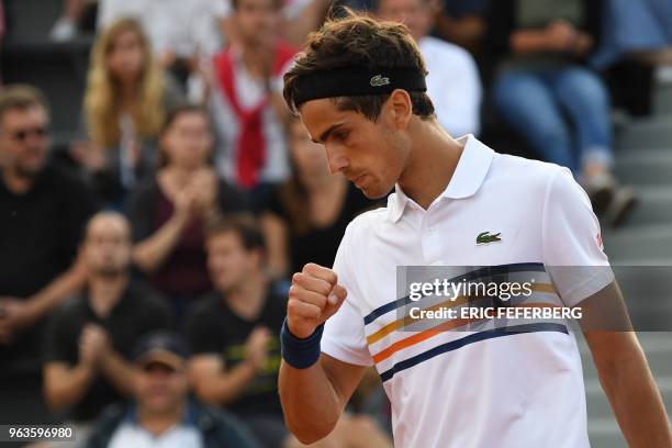 France's Pierre-Hugues Herbert reacts after a point during his men's singles first round match against Canada's Peter Polansky on day three of The...