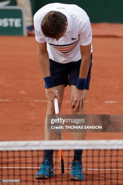 France's Nicolas Mahut reacts after a point against Argentina's Juan Martin del Potro during their men's singles first round match on day three of...