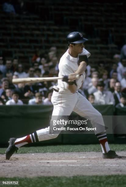 S: Outfielder Tony Conigliaro of the Boston Red Sox swings at a pitch during a circa mid 1960's Major League Baseball game at Fenway Park in Boston,...