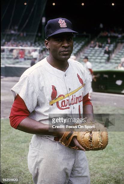 First Baseman Bill White of the St. Louis Cardinals warming up before a circa 1960's Major League Baseball game. White played for the Cardinals from...