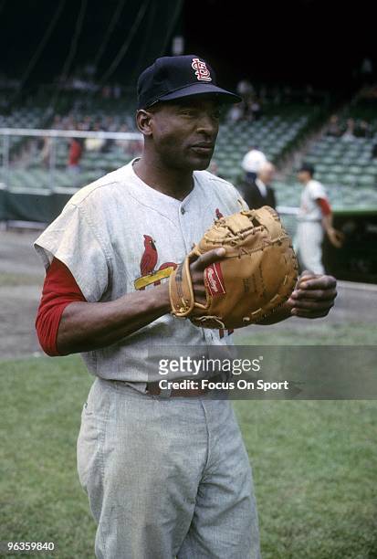 First Baseman Bill White of the St. Louis Cardinals warming up before a circa 1960's Major League Baseball game. White played for the Cardinals from...