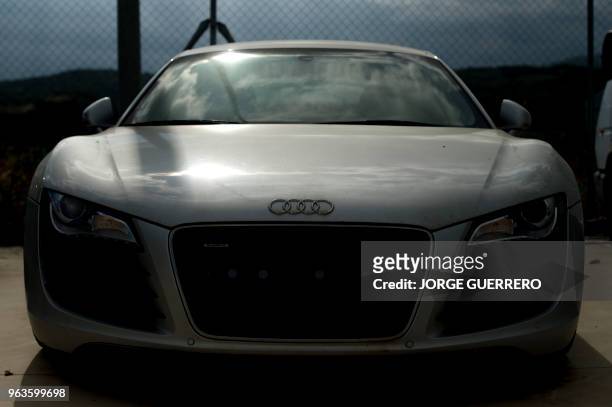 An Audi R8 seized from drug cartels sits in a parking lot in San Roque near Algeciras on May 29, 2018. - Over 3,500 vehicles and 1,000 boats seized...