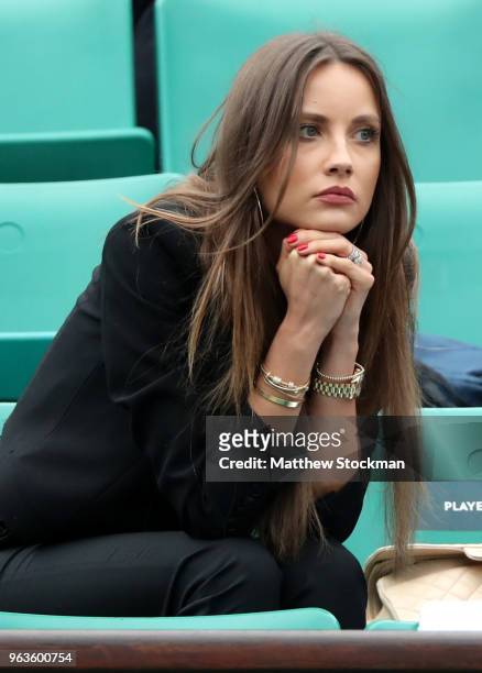 Ester Berdych Satorova, wife of Thomas Berdych of Czech Republic watches on as he plays his mens singles first round match against Jeremy Chardy of...