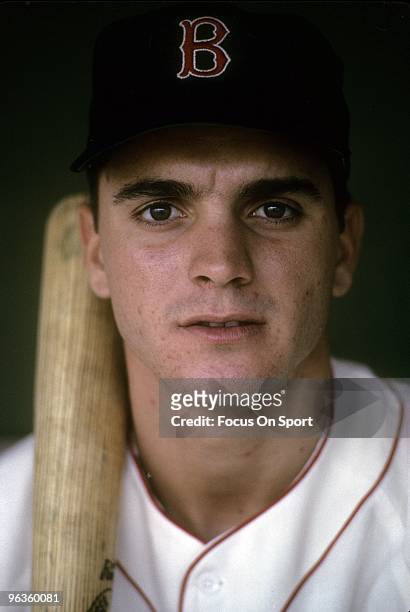 S: Outfielder Tony Conigliaro of the Boston Red Sox with bat on shoulder sitting in the dougout before the start of a circa mid 1960's Major League...
