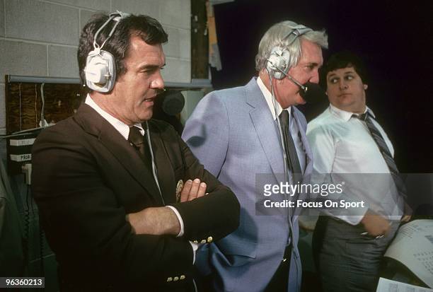 Play by play announcer Pat Summerall and color commentator Tom Brookshier in the booth calling an NFL football game mid circa 1980's. Summerall has...