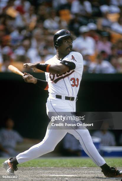 S: First baseman Eddie Murray of the Baltimore Orioles swings and watches the flight of his ball during a Major League Baseball game circa late...