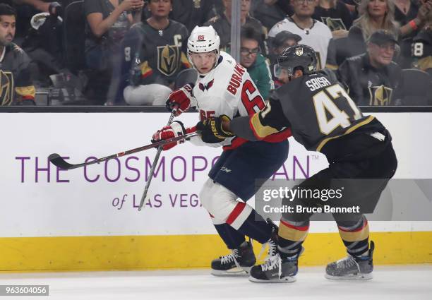 Andre Burakovsky of the Washington Capitals skates against Luca Sbisa of the Vegas Golden Knights in Game One of the 2018 NHL Stanley Cup Final at...