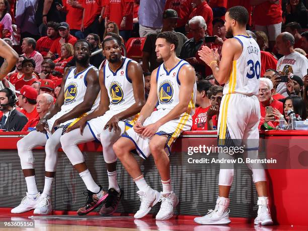 Draymond Green, Kevin Durant, Klay Thompson, and Stephen Curry of the Golden State Warriors look on in Game Seven of the Western Conference Finals...