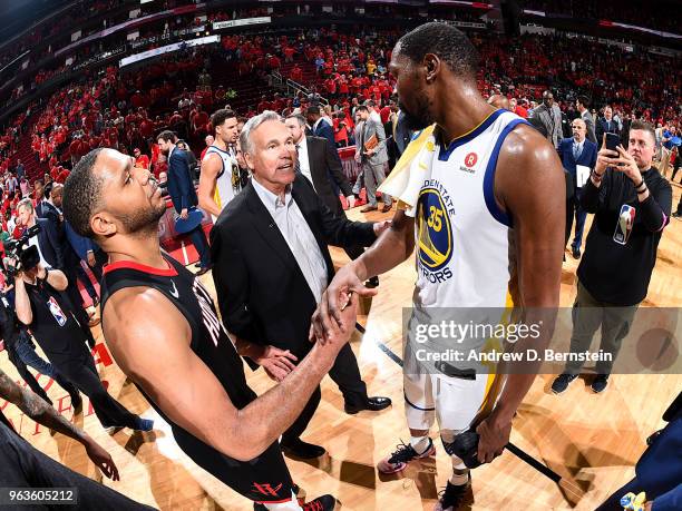 Eric Gordon and head coach Mike D'Antoni of the Houston Rockets shake hands with Kevin Durant of the Golden State Warriors after Game Seven of the...