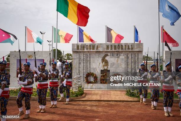 Guard of honour of the Bangladeshi military police contingent parade in front of a commemorative memorial during the ceremony of Peacekeepers' Day at...