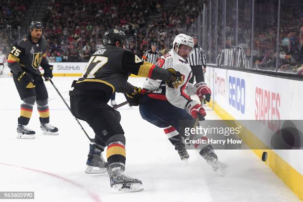 Jay Beagle of the Washington Capitals battles for the puck with Luca Sbisa of the Vegas Golden Knights in Game One of the 2018 NHL Stanley Cup Final...