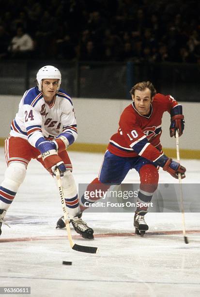 Right Wing Guy LaFleur of the Montreal Canadiens in action against Pierre Plante of the New York Rangers during a circa 1979 NHL Hockey game at...