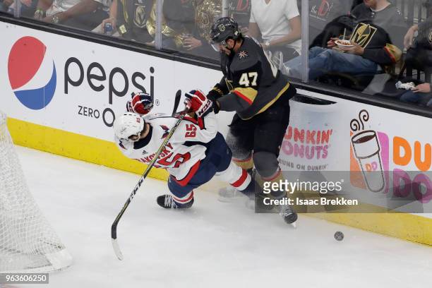Luca Sbisa of the Vegas Golden Knights checks Andre Burakovsky of the Washington Capitals in Game One of the 2018 NHL Stanley Cup Final at T-Mobile...