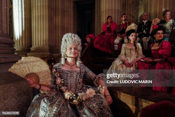 People dressed in period costumes take part in the "Fetes Galantes" fancy dress evening at the Chateau de Versailles in Versailles, west of Paris, on...