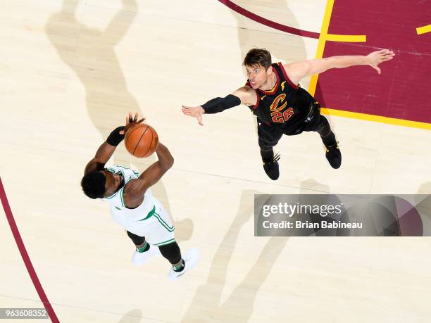 Jaylen Brown of the Boston Celtics shoots the ball over Kyle Korver of the Cleveland Cavaliers during Game Six of the Eastern Conference Finals of...
