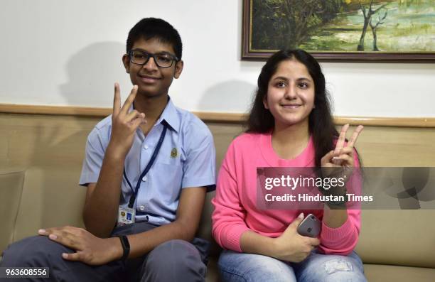 Anchit Jain and Anshika gupta students of Amity International school pose for a photograph, who scored 498 marks out of 500 in CBSE class 10th boards...