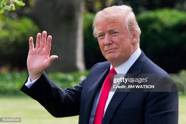 President Donald Trump waves as he departs the White House in Washington, DC, for Nashville, Tennessee, on May 29, 2018.