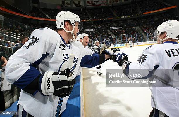 Stephane Veilleux of the Tampa Bay Lightning is congratulated by Todd Fedoruk after scoring a goal against the Atlanta Thrashers at Philips Arena on...