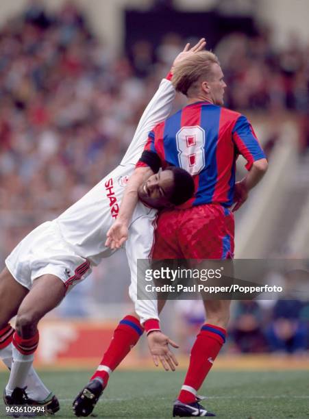 Geoff Thomas of Crystal Palace holds down Paul Ince of Manchester United during the FA Cup Final at Wembley Stadium on May 12, 1990 in London,...